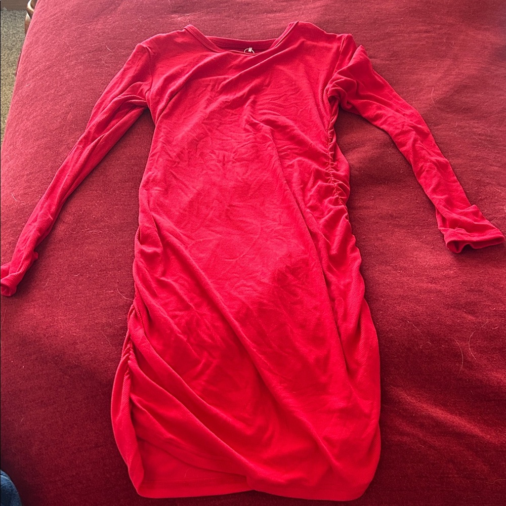 Elegant Red Long Sleeve Dress. Tight fitting and down to the lower thigh.